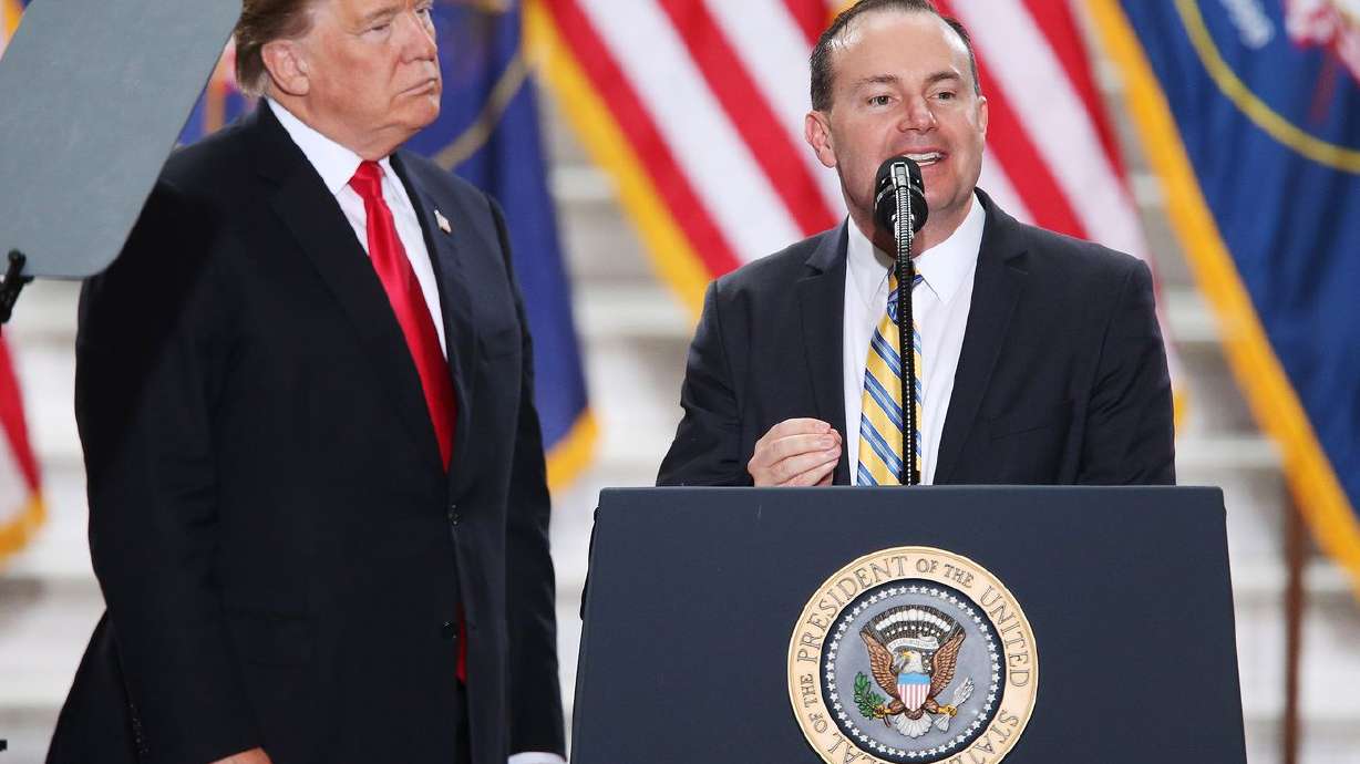 Sen. Mike Lee, R-Utah, right, speaks as President Donald Trump looks on at the Capitol in Salt Lake City on Dec. 4, 2017. An account of Lee vetting Trump’s election fraud claims appears in a new book about the last days of the former
president’s one term in office.