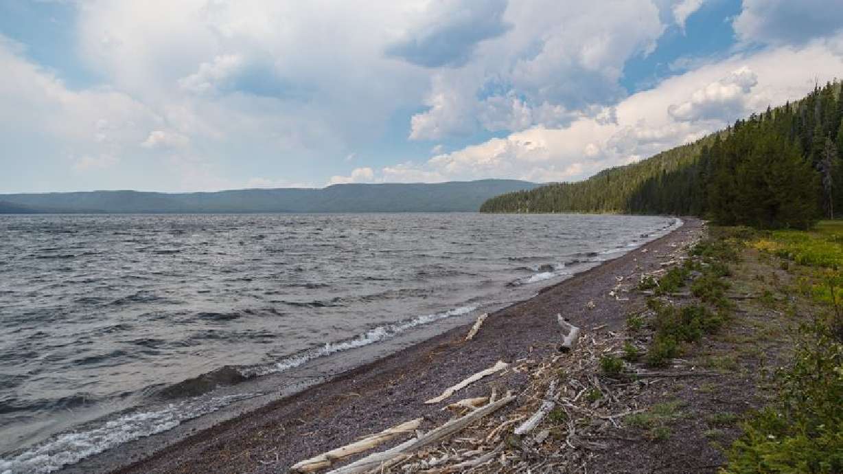 Yellowstone National Park officials say Mark O'Neill died of hypothermia. His brother, Kim Crumbo from Utah, has not been found.