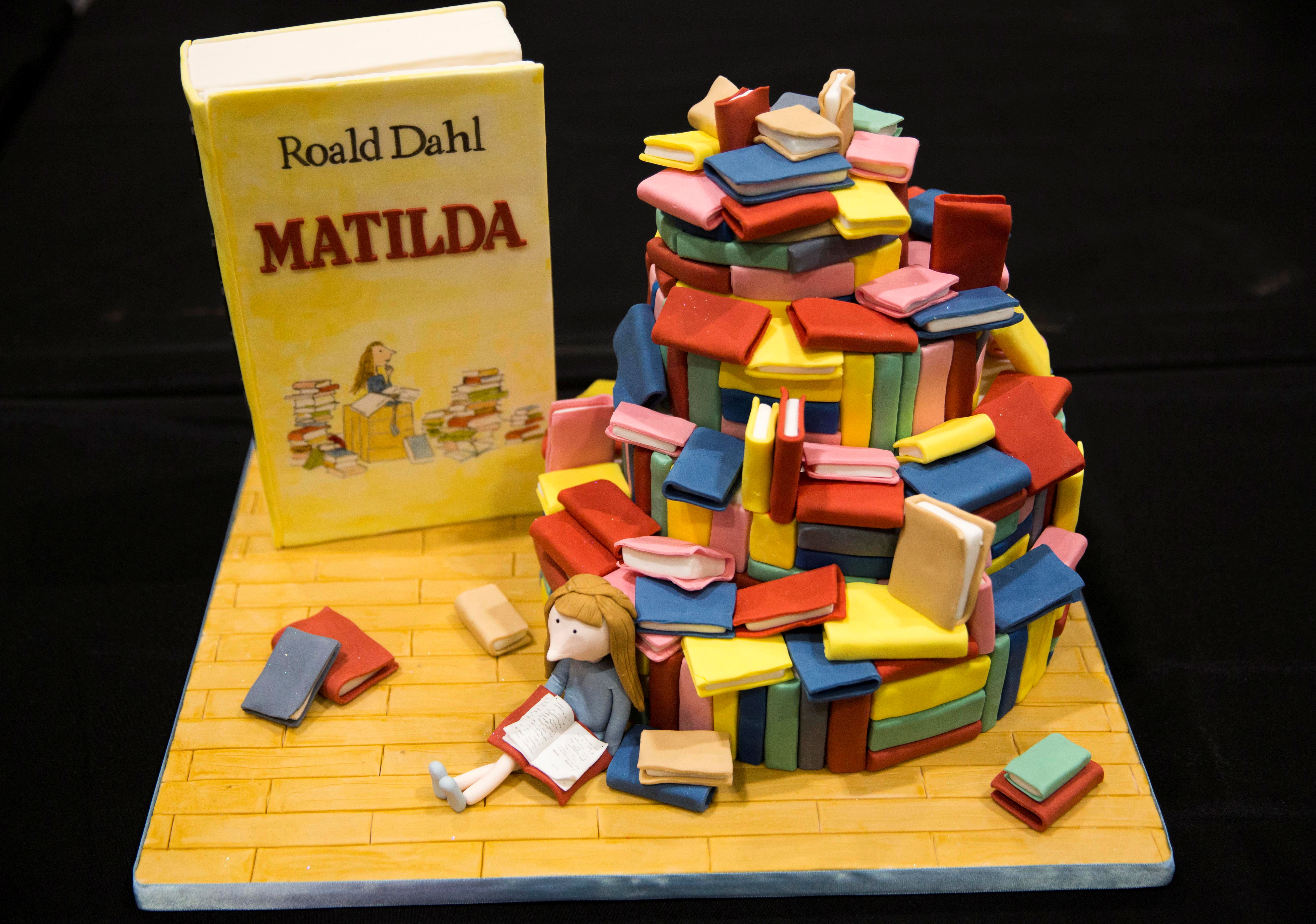 A cake decorated in the style of the Roald Dahl children's book "Charlie and the Chocolate Factory" is displayed at the Cake and Bake show in London on Oct. 3, 2015. Netflix has bought the works of Roald Dahl, including classics such as "Charlie and the Chocolate Factory" and "Matilda," in a competitive move against Disney+ and HBO Max.