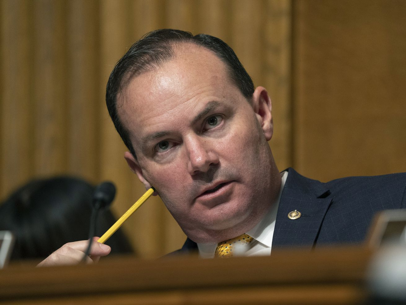 Ranking committee member Sen. Mike Lee, R-Utah, asks questions to witnesses as they testify before the Senate Judiciary Subcommittee on Tuesday in Washington. Lee took issue with suggestions in a Senate hearing Wednesday that requiring photo identification to vote is racially discriminatory.