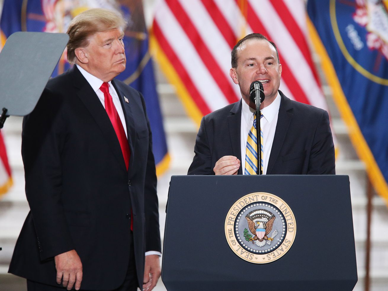 Sen. Mike Lee, R-Utah, speaks as President Donald Trump
looks on at the Capitol in Salt Lake City on Monday, Dec. 4, 2017.
Trump was in town to sign proclamations scaling back Bears Ears and
Grand Staircase-Escalante national monuments.