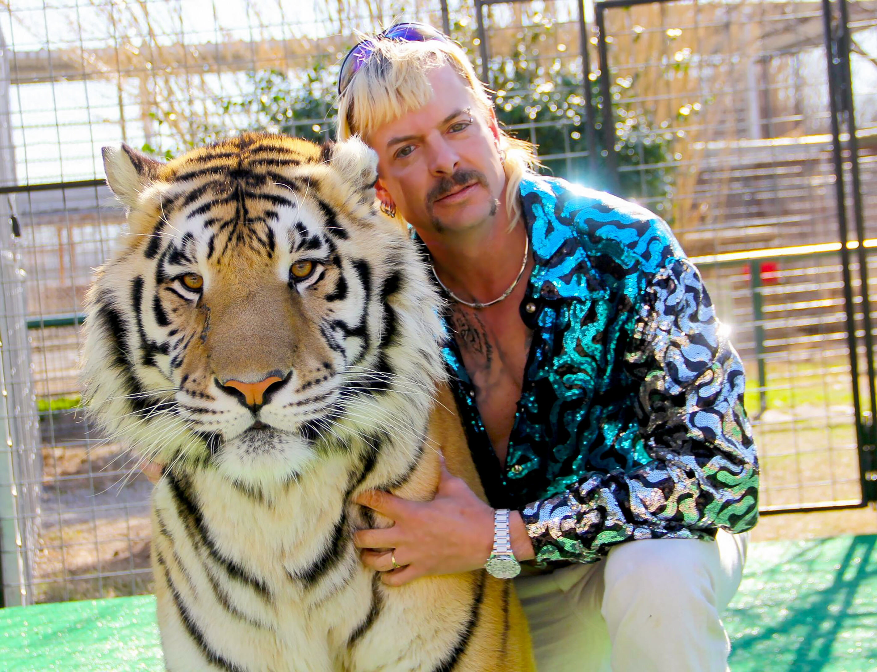 Joseph Maldonado-Passage aka Joe Exotic and one of his cats in the Netflix docuseries "Tiger King: Murder, Mayhem and Madness."