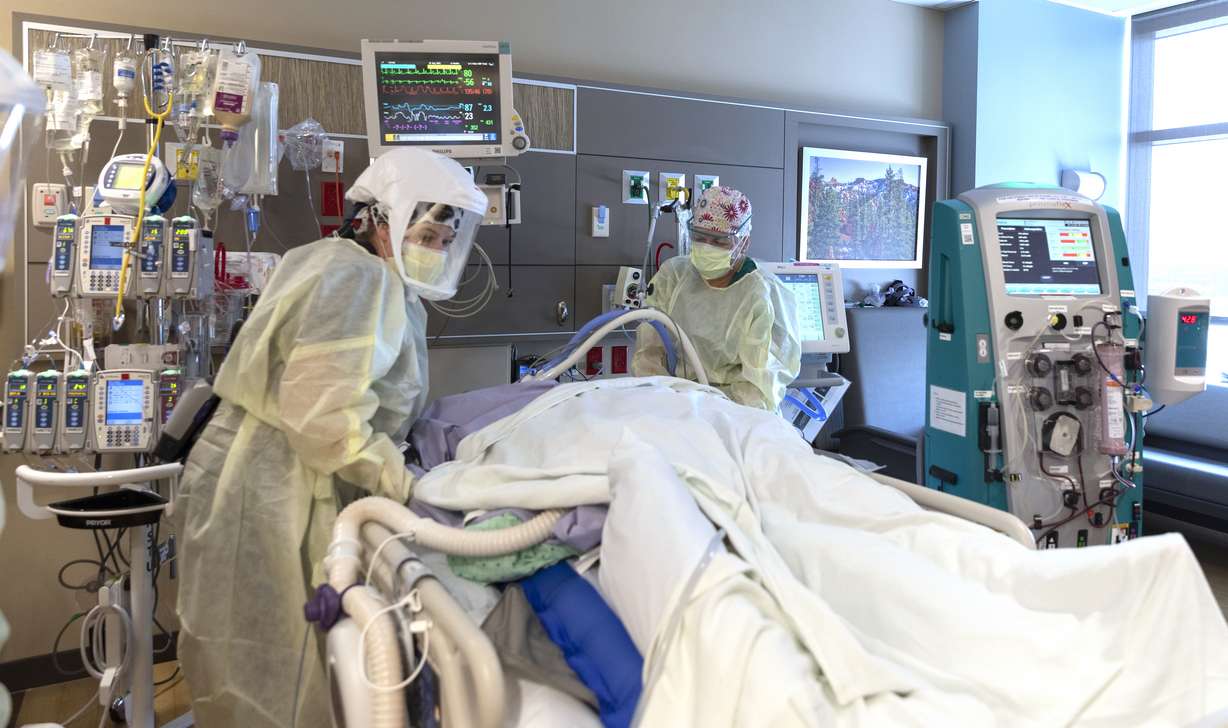 Medical staff treat a patient inside Utah Valley Hospital's COVID-19 ICU on Aug 25 in Provo.