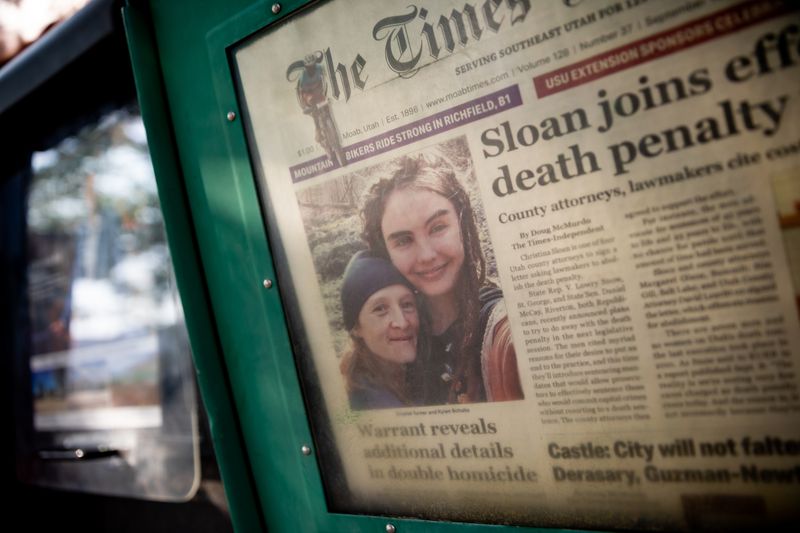 Crystal Turner and Kylen Schulte are pictured on the
front page of The Times-Independent in a newspaper rack outside of
the Moonflower Community Cooperative, where Schulte worked, in Moab
on Sunday, Sept. 19.