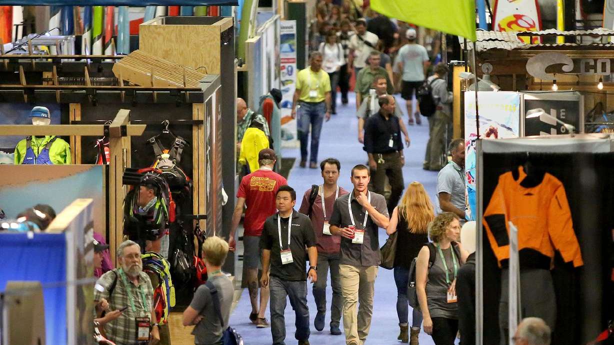 People walk through the Outdoor Retailer show at the Salt Palace Convention Center in Salt Lake City in July 2017. Could the mammoth and lucrative shows be headed back to Salt Lake City?