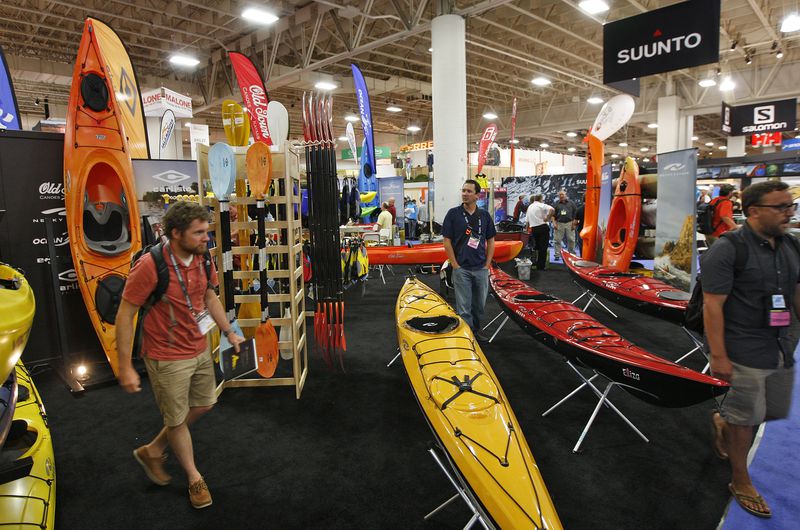 People attend the Outdoor Retailers show Aug. 2, 2012, in Salt Lake City.