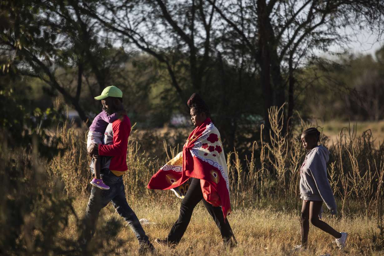 Haitian migrants look for a place to wade the Rio Grande to cross the U.S.-Mexico border from Ciudad Acuña, Mexico, Thursday, after Mexican security forces deployed to block access to the river to immigrants.