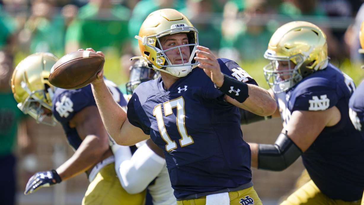 Notre Dame quarterback Jack Coan (17) throws against Purdue during the first half of an NCAA college football game in South Bend, Ind., Saturday, Sept. 18, 2021.