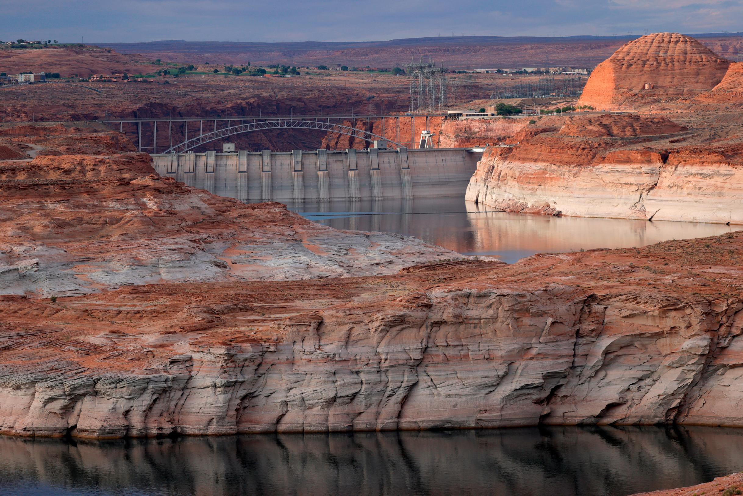 The Glen Canyon Dam is seen here at Lake Powell in Arizona in June. Global scientists reported in August that due to the climate crisis, droughts that may have occurred only once every decade or so now happen 70% more frequently. The increase is particularly apparent in the Western U.S.