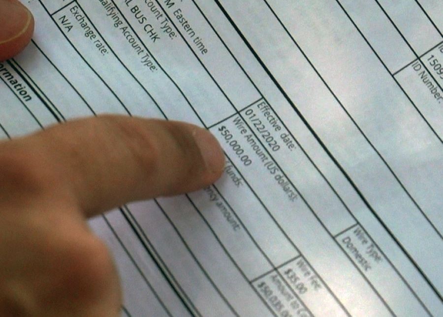 Christina Ott shows KSL-TV a $50,000 wire transfer. She believes close to a million dollars were moved through her accounts during an online courtship.