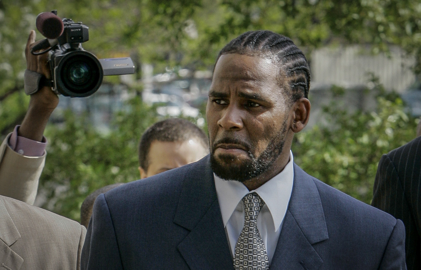 This photo from Friday May 9, 2008, shows R. Kelly arriving for the first day of jury selection in his child pornography trial at the Cook County Criminal Courthouse in Chicago. On Friday, jury began deliberating Kelly's sex trafficking trial at Brooklyn Federal Court in New York.