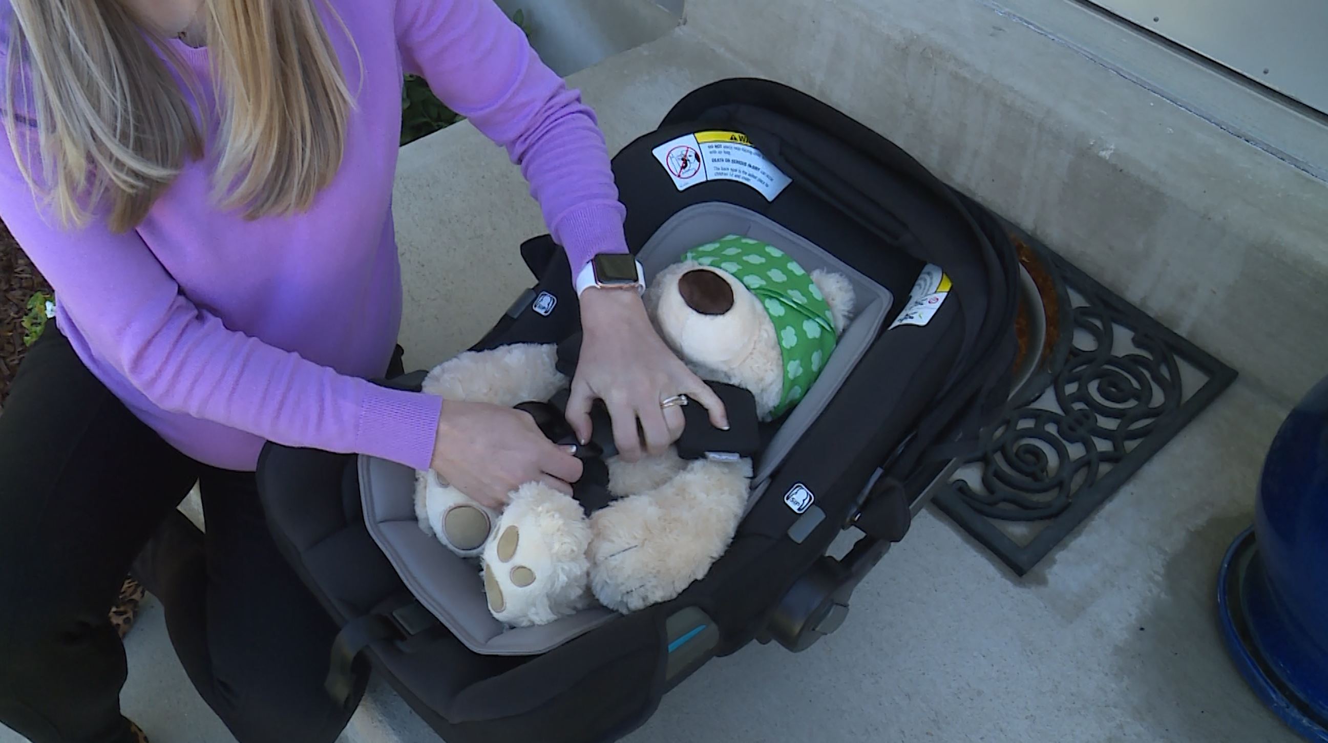 Car seat safety technician Michelle Jamison taught KSL reporter Aley Davis how to properly tighten and secure the safety straps on her car seat before the arrival of her new baby.