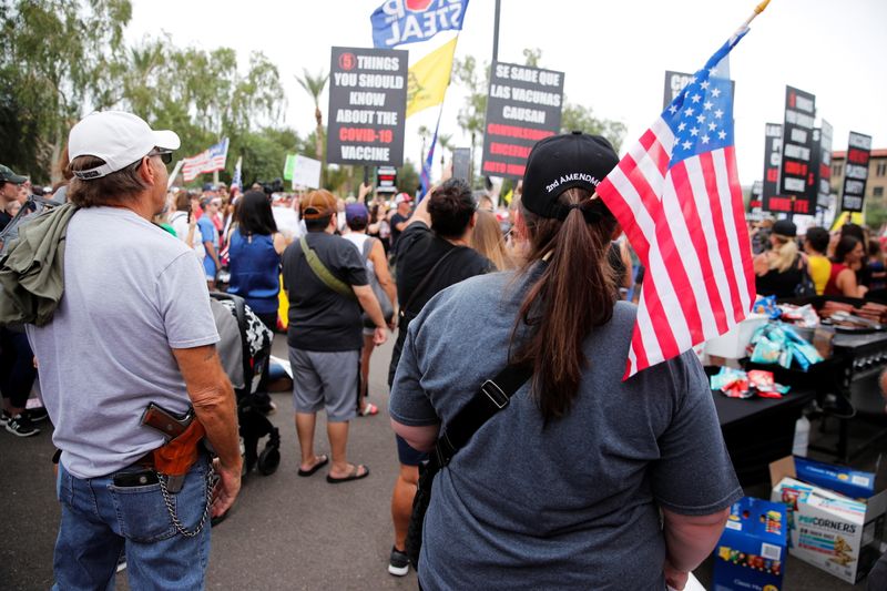 People gather outside Arizona Government building ahead of the announcement of interim findings from a widely criticized audit of the 2020 election in Phoenix, Arizona, Friday.