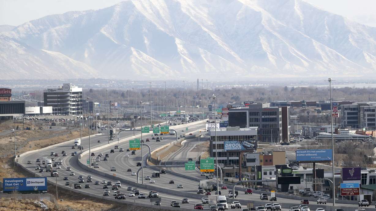 Traffic moves along I-15 in Lehi on Dec. 16, 2020. Portions of the freeway will be closed at times every day from Monday to Friday as the Utah Department of Transportation removes more light poles.