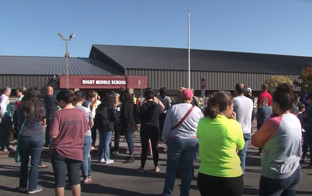 Parents wait to pick up their kids from Rigby Middle School Thursday morning. Students in secondary schools are no longer able to use backpacks after a 13-year-old girl brought a gun to school.