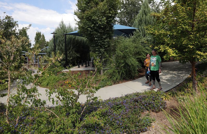 Trina Bradford and Pat Bradford explore the Jordan
Valley Water Conservancy District’s Conservation Garden Park in
West Jordan on Sept. 10 as they contemplate plans
for flipping their park strip.