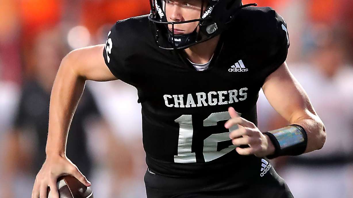 Corner Canyon’s Devin Brown spins and looks down field for an open receiver as they and Skyridge play a high school football game at Corner Canyon in Draper on Friday, Sept. 24, 2021. Corner Canyon won 38-23.