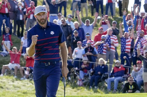 Team USA's Dustin Johnson reacts after winning the 11th hole during a four-ball match the Ryder Cup at the Whistling Straits Golf Course Friday, Sept. 24, 2021, in Sheboygan, Wis.