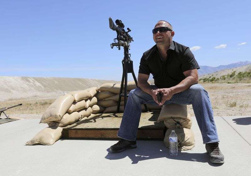 TacGas CEO Jim Staley talks with his crew during a promotional video and photo shoot for a TacGas client at Special Weapons Test Center near Grantsville on May 12.