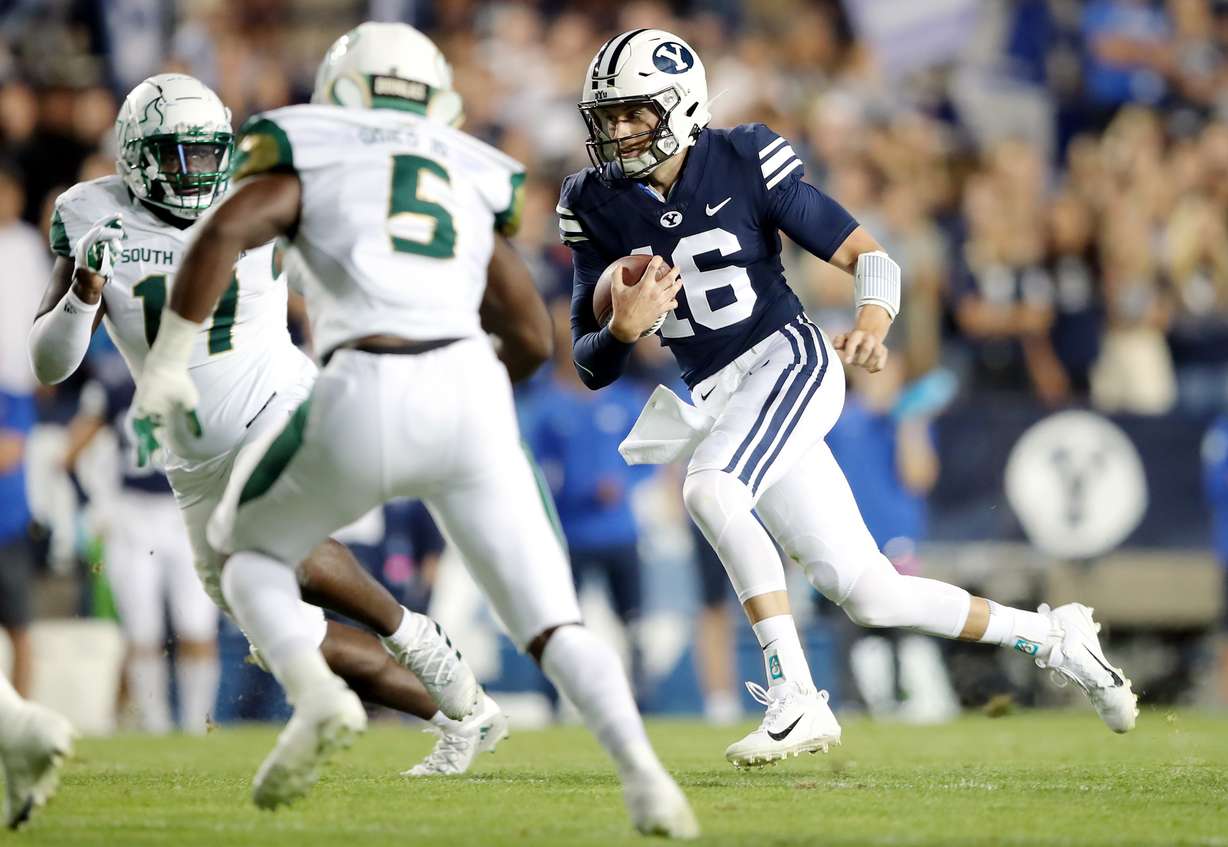 BYU quarterback Baylor Romney (16) takes off on a run as BYU and USF play a college football game at LaVell Edwards Stadium in Provo on Saturday, Sept. 25, 2021.