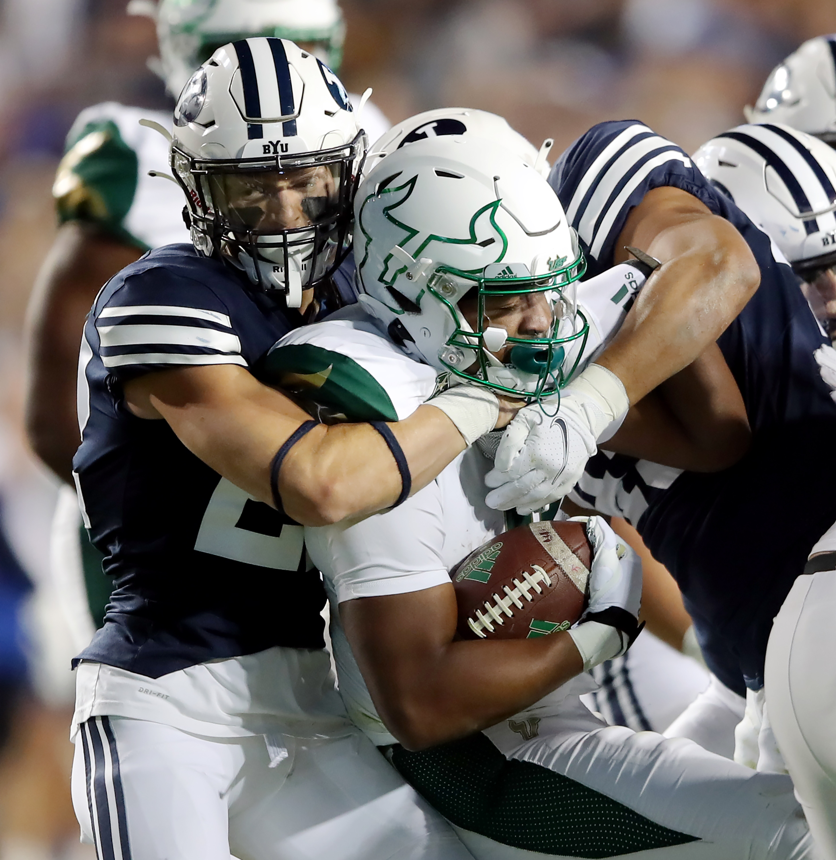 BYU defensive back Ammon Hannemann (22) makes a tackle on South Florida Bulls running back Jaren Mangham (0) as BYU and USF play a college football game at LaVell Edwards Stadium in Provo on Saturday, Sept. 25, 2021.