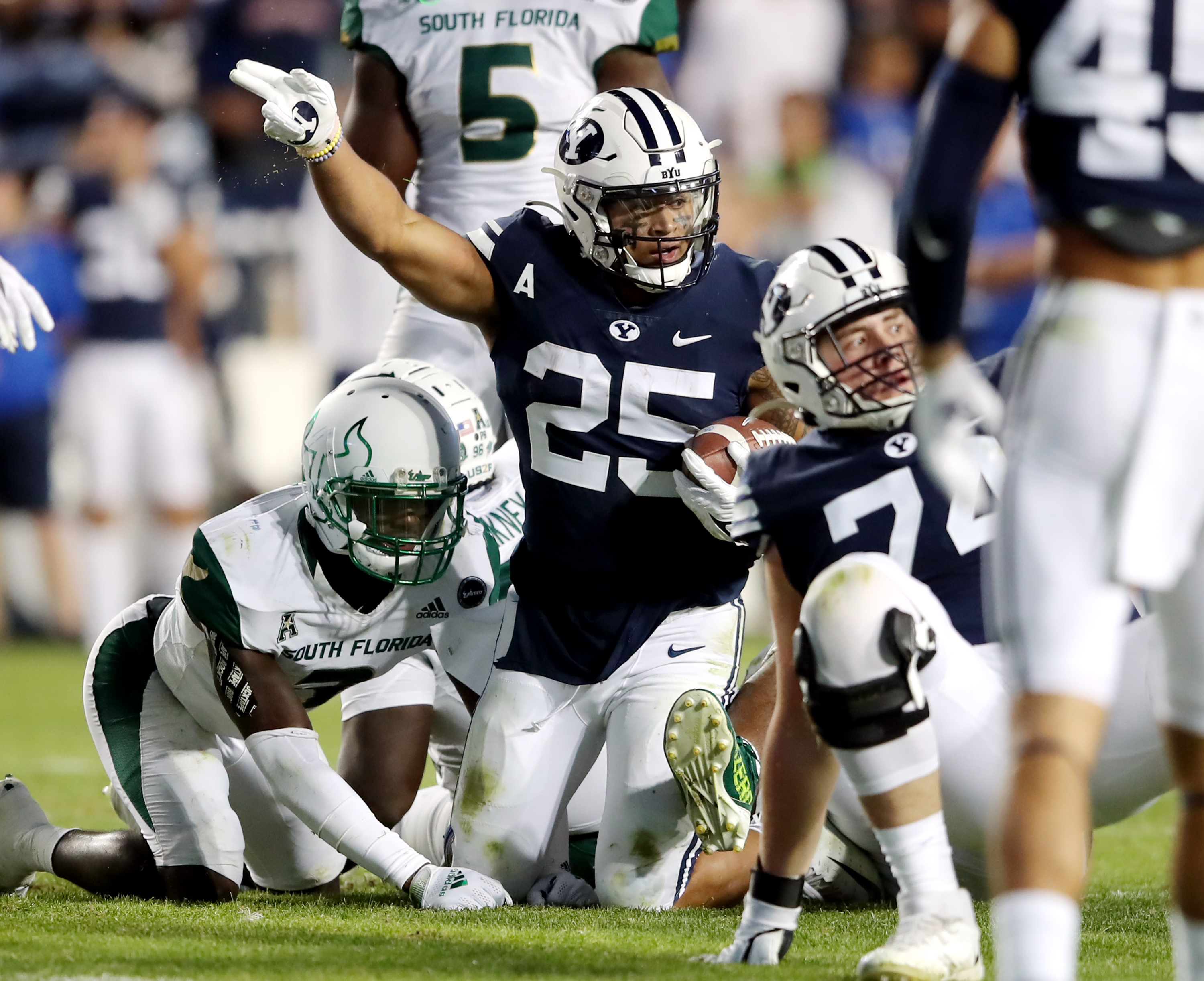 BYU running back Tyler Allgeier (25) motions first down after a run as BYU and USF play a college football game at LaVell Edwards Stadium in Provo on Saturday, Sept. 25, 2021. BYU won 35-27.