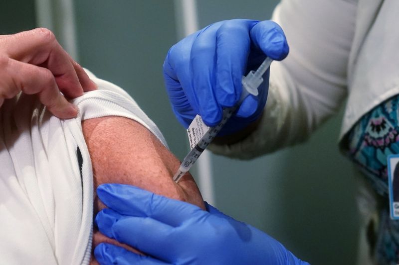 A nurse receives one of the first vaccinations at Mt. Sinai Hospital from Pfizer-BioNTech during the COVID-19 pandemic in the Manhattan borough of New York City on Dec. 15, 2020.