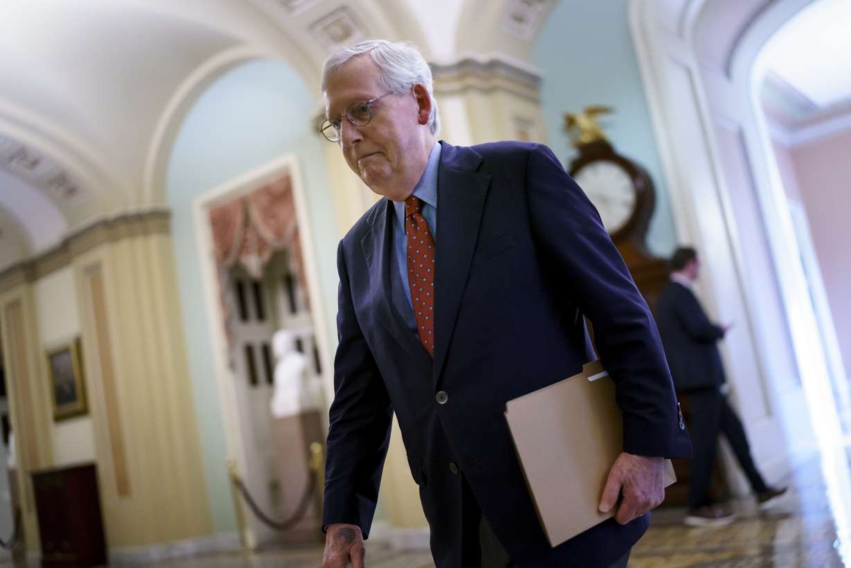 Senate Minority Leader Mitch McConnell, R-Ky., walks to the chamber for a test vote on a government spending bill, at the Capitol in Washington, on Monday.
