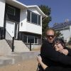 'A true gift' built by students: Davis School District employee receives the keys to her first home