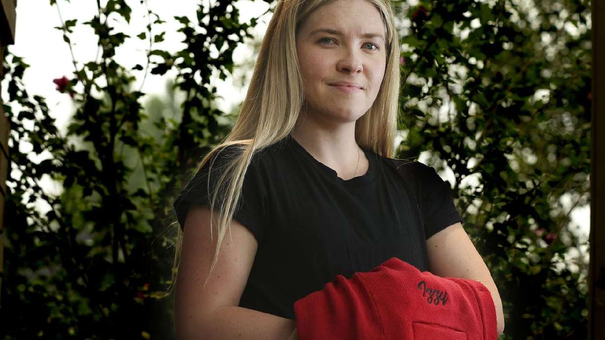 Izzy Johnston, a former West High School and Boise State University cheerleader, is photographed in Centerville on Aug. 6. She closely followed the case of the so-called cussing cheerleader, Brandi Levy.