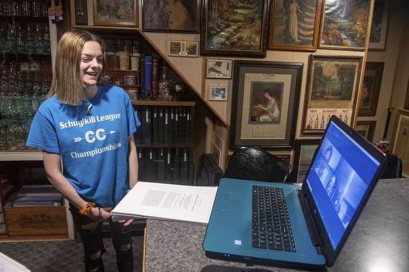 Brandi Levy smiles as she speaks with American Civil
Liberties Union of Pennsylvania Legal Director Witold "Vic” Walczak
after hearing the U.S. Supreme Court ruled in her favor on June 23 in Mahanoy City, Pa.