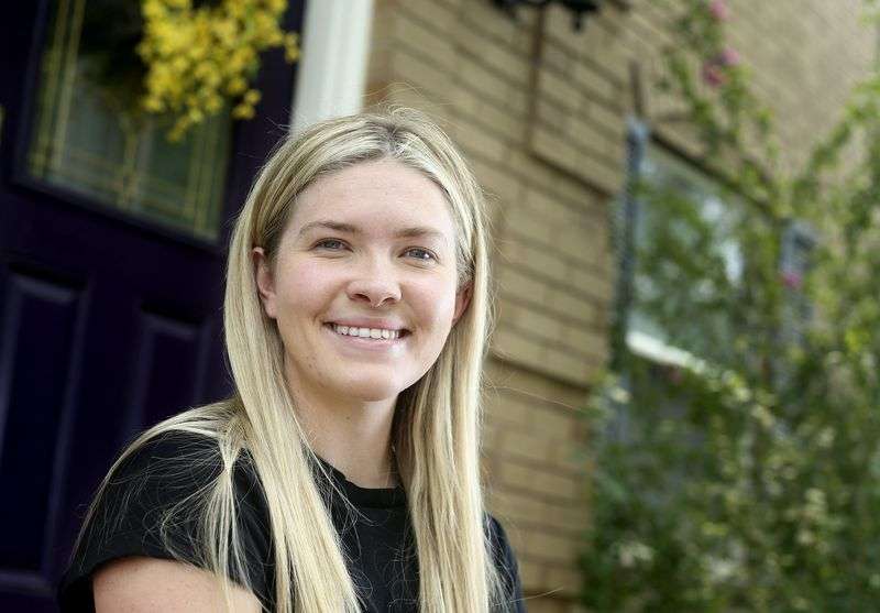 Izzy Johnston, a former cheerleader, is photographed in
Centerville on Aug. 6.