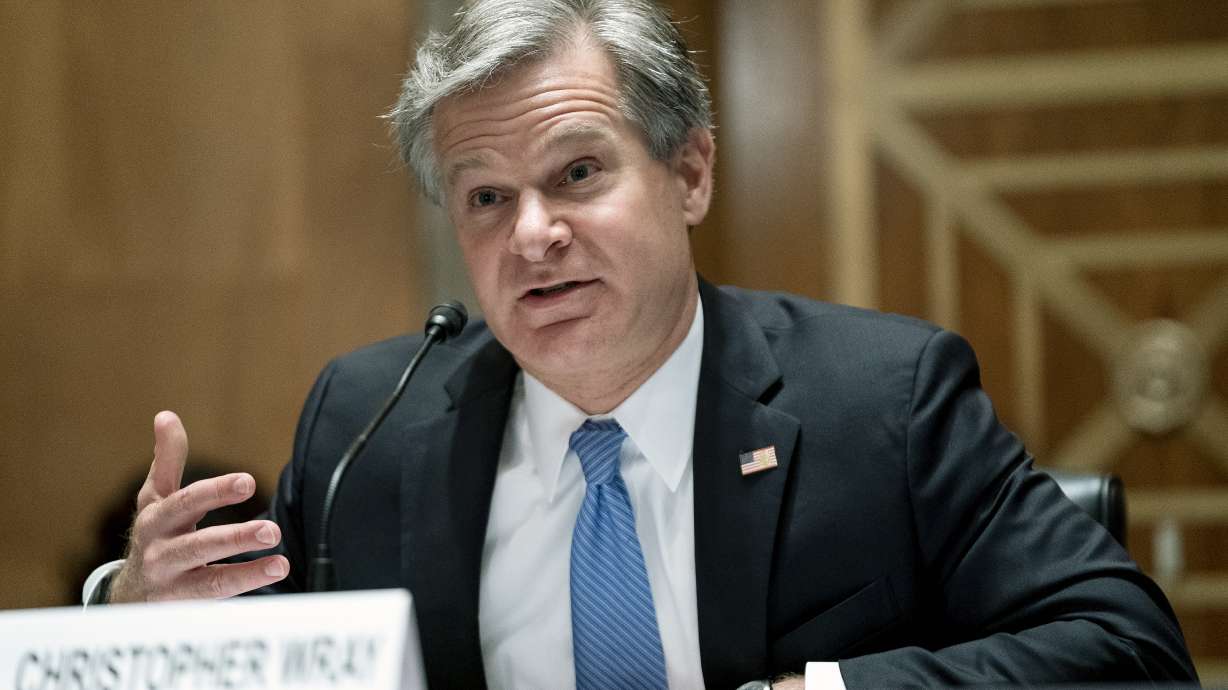 FBI Director Christopher Wray testifies before a Senate Homeland Security and Governmental Affairs Committee hearing Sept. 21, in Washington. The number of murders in the U.S. rose nearly 30% in 2020 and overall violent crime rose for the first time in four years, the FBI said Monday.