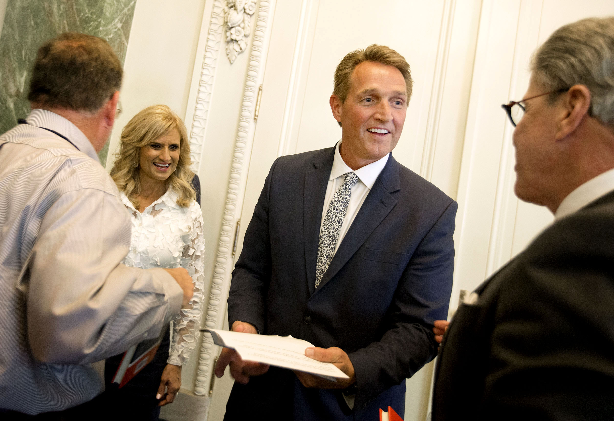 Cheryl Flake, wife of Sen. Jeff Flake, R-Ariz., and the senator speak with friends after Flake spoke at the Salt Lake Chapter of the BYU Management Society's 4th Annual Moral & Ethical Leadership Conference at the Joseph Smith Memorial Building in Salt Lake City on Sept. 14.