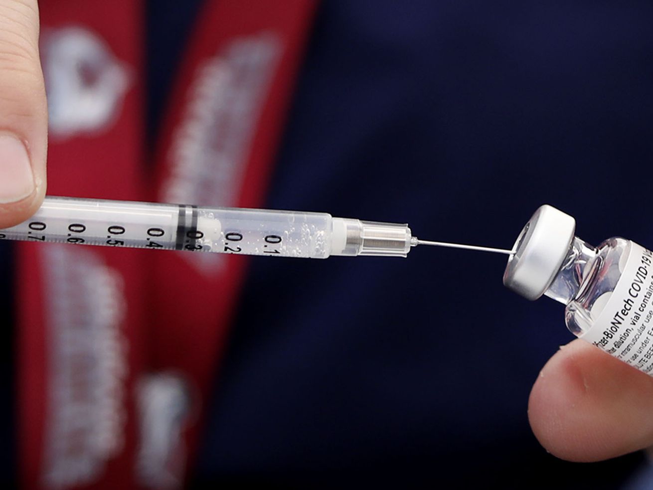 Kimberly Desmond, a registered nurse, draws a dose of the Pfizer-BioNTech COVID-19 vaccine into a syringe at Rose Park
Elementary in Salt Lake City on Sept. 22. Promising to return to the Senate floor as long as it takes, Sen. Mike Lee unsuccessfully rolled out the first of a dozen bills Tuesday he drafted to upend Biden’s yet-to-be issued vaccination mandate.