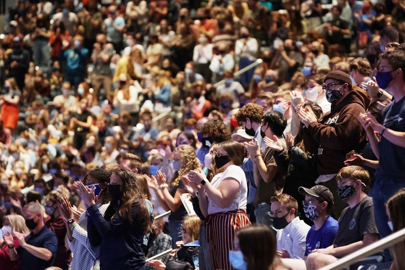 Students stand and applaud as Martin Luther King III
speaks during a Brigham Young University forum at the Marriott
Center in Provo on Tuesday.