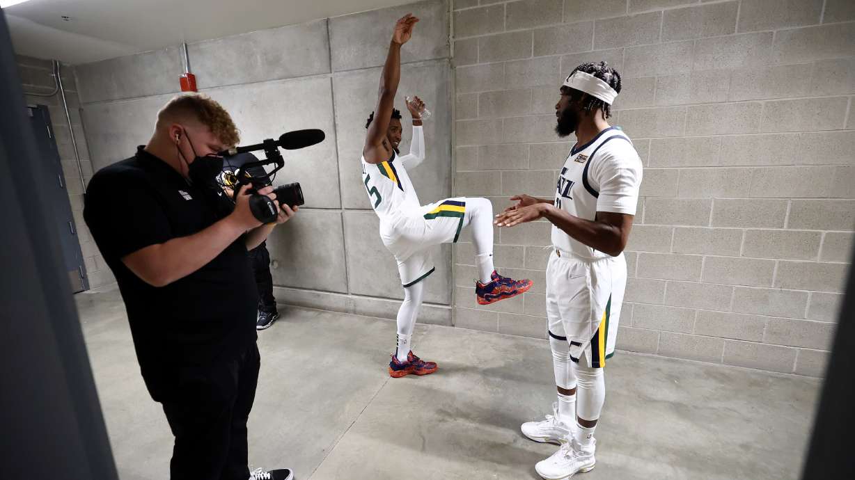 Utah Jazz guard Donovan Mitchell (45) and Jazz guard Mike Conley (11) talk in the hallway after being interviewed during the Utah Jazz media day at Vivint Arena in Salt Lake City on Monday.