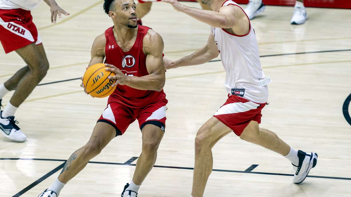 Marco Anthony looks to fake Riley Battin during a scrimmage as the University of Utah’s men’s basketball team opens camp with practice inside the Jon M. and Karen Huntsman Basketball Facility in Salt Lake City on Tuesday, Sept. 28, 2021.