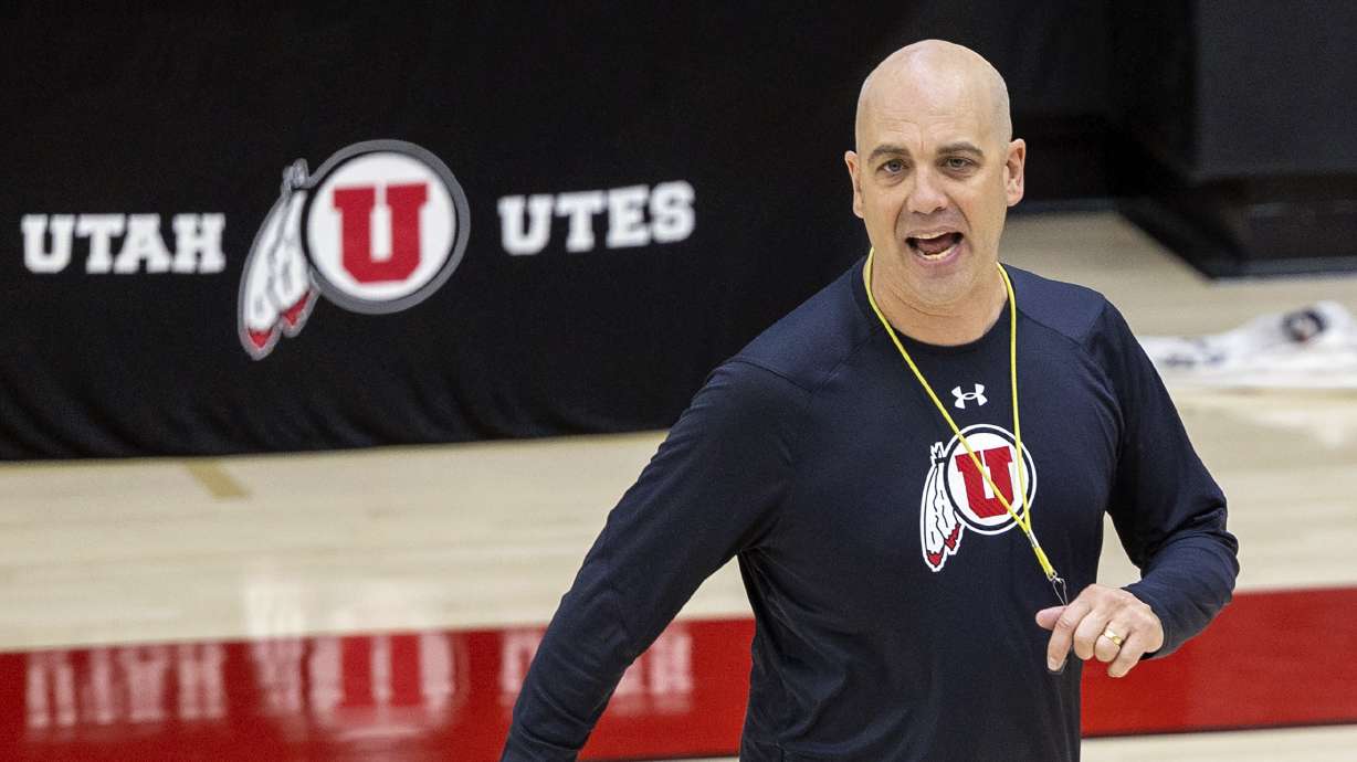 Head coach Craig Smith talks to his players as the University of Utah’s men’s basketball team opens camp with practice inside the Jon M. and Karen Huntsman Basketball Facility in Salt Lake City on Tuesday, Sept. 28, 2021.