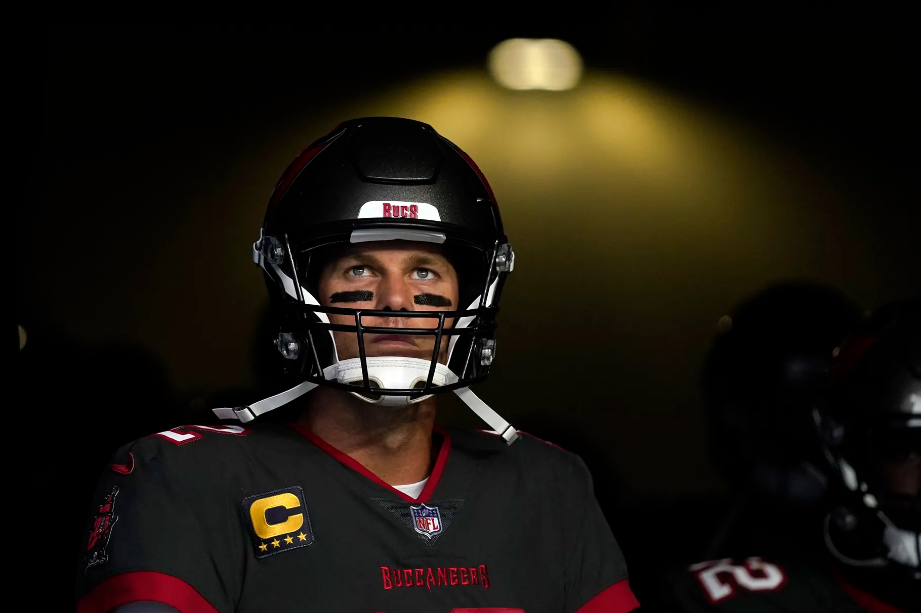 Tampa Bay Buccaneers quarterback Tom Brady waits to run onto the field before an NFL football game against the Los Angeles Rams Sunday, Sept. 26, in Inglewood, Calif. Brady will return Sunday to play at New England, site of his greatest successes as a pro football star. 