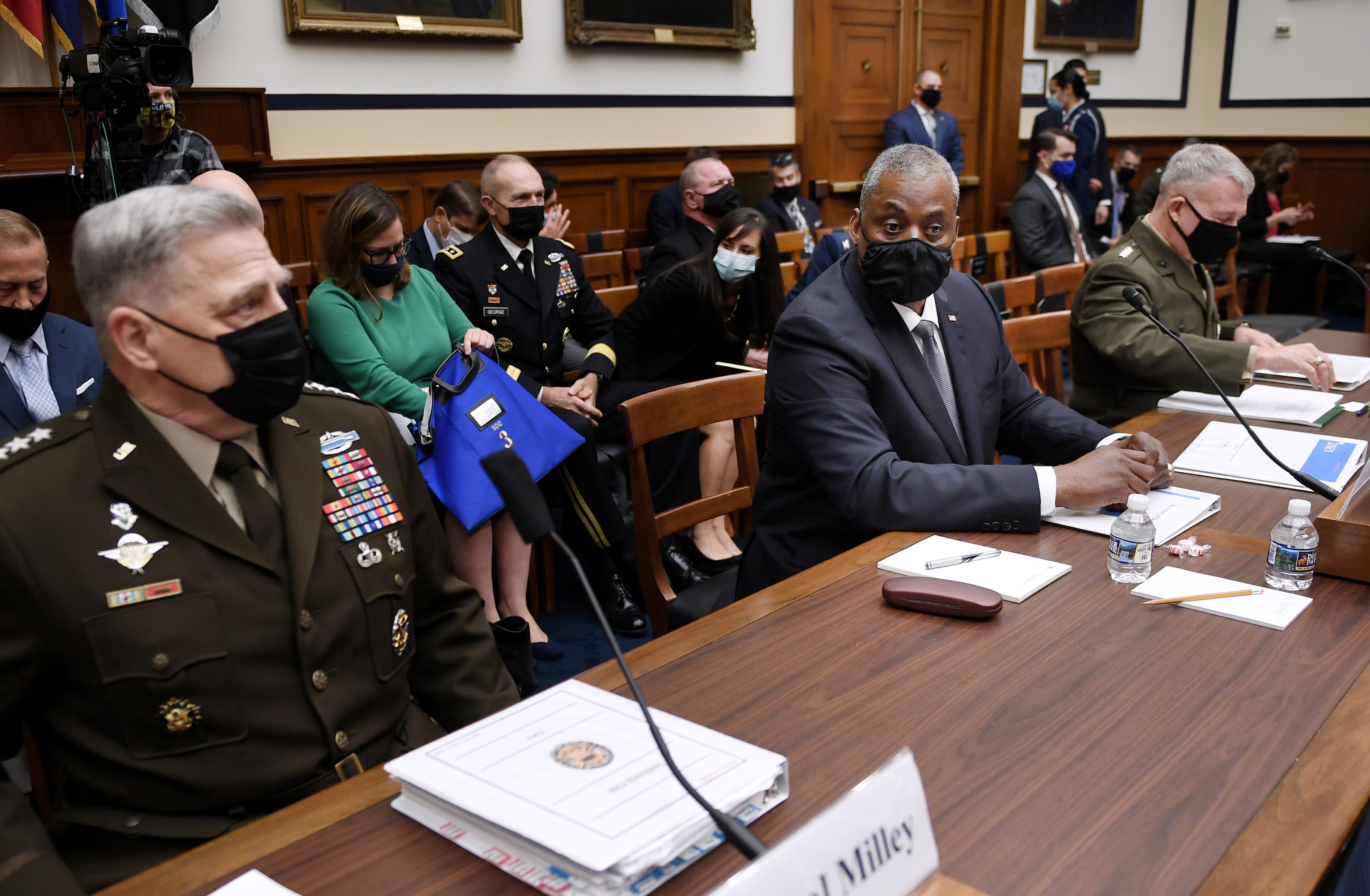 Secretary of Defense Lloyd J. Austin, Chairman of the Joint Chiefs of Staff Gen. Mark A. Milley and Marine Corps Gen. Kenneth F. McKenzie, commander of U.S. Central Command, appear at a House Armed Services Committee hearing on the conclusion of military operations in Afghanistan at the Rayburn House Office building on Capitol Hill in Washington, D.C., on Wednesday.