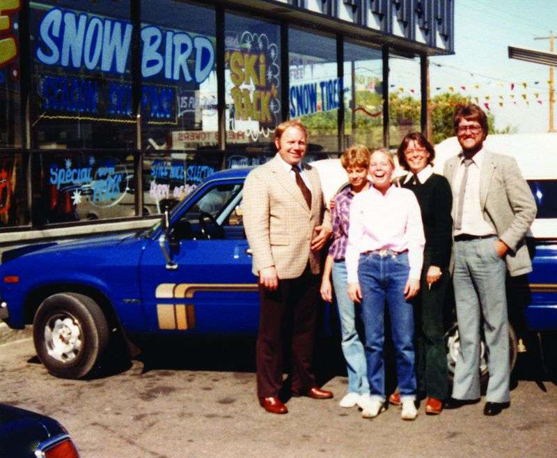Evan Ellis sold the first vehicle when Larry H. Miller
Toyota first opened in Murray in 1979. Pictured here with Larry H.
Miller, left, and Ellis are the customers who purchased that
vehicle the second time it was sold by Larry H. Miller Toyota. The
first owner turned it in on a new vehicle and Ellis sold it
again.