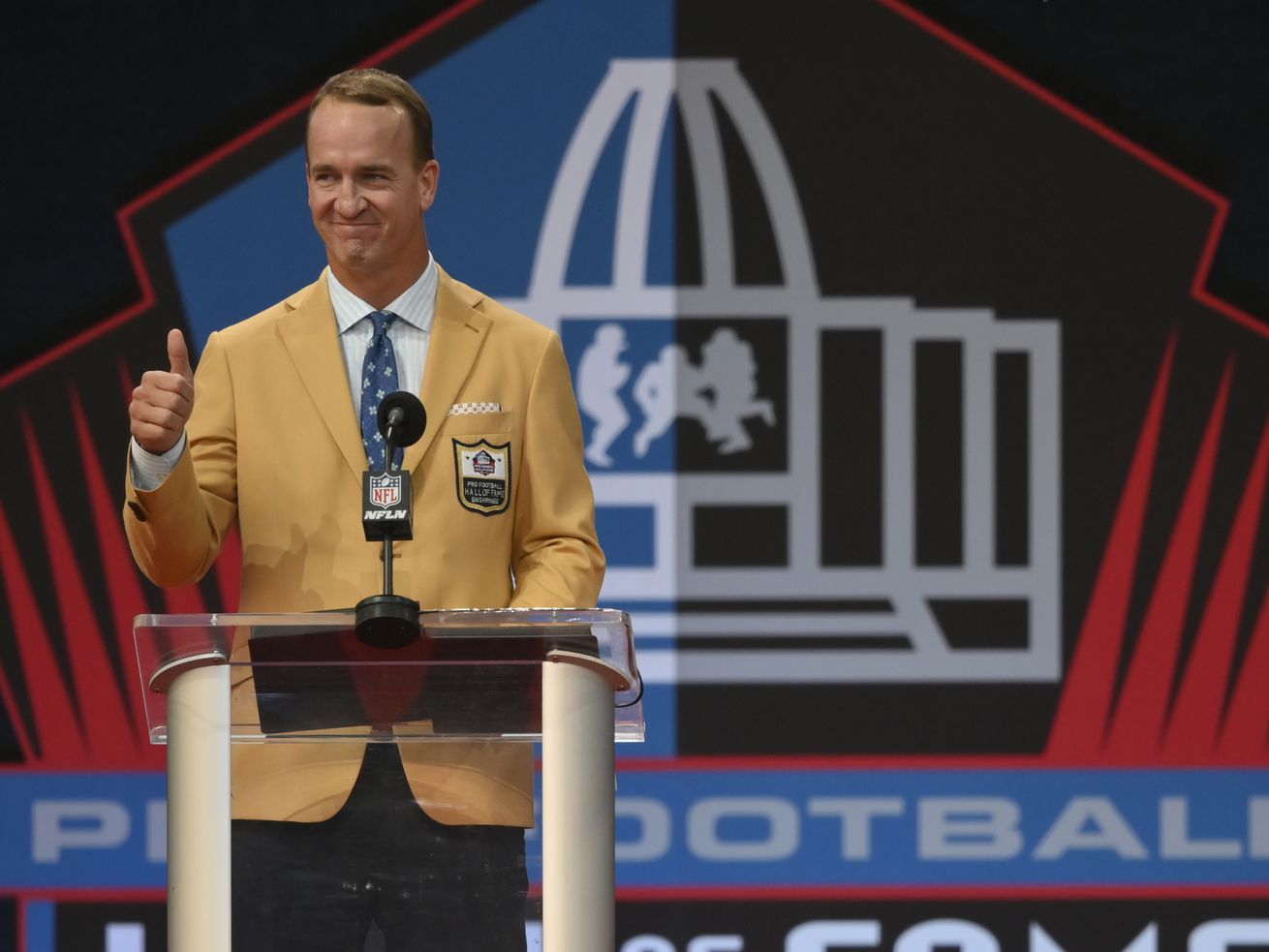 Peyton Manning, a member of the Pro Football Hall of Fame Class of 2021, speaks during the induction ceremony at the Pro Football Hall of Fame on Aug. 8, in Canton, Ohio. Manning,
kicked off the annual user summit Wednesday for Utah financial technology innovator MX.