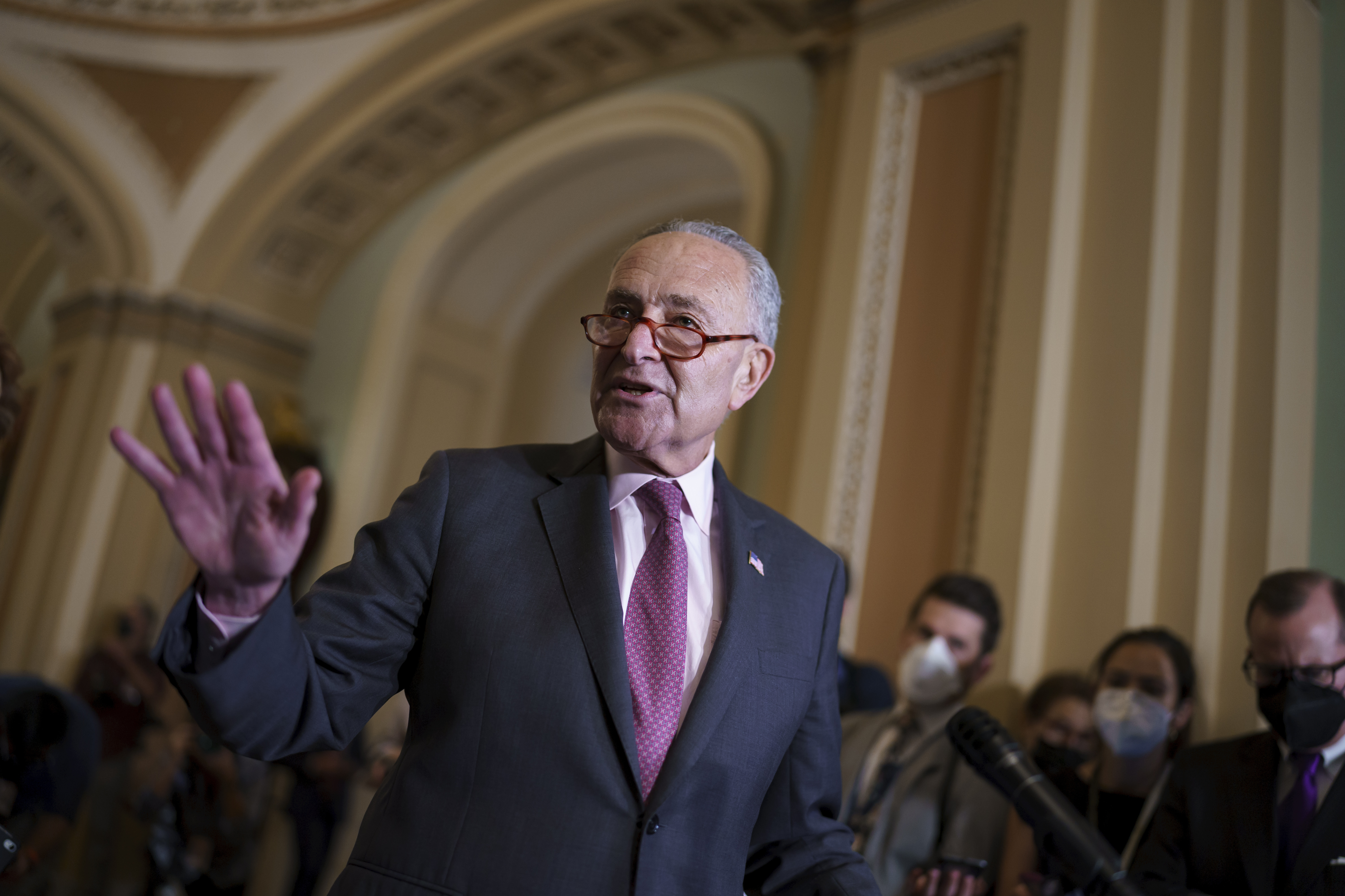 Senate Majority Leader Chuck Schumer, D-N.Y., speaks to reporters after a Democratic policy meeting at the Capitol in Washington on Tuesday. Congress is moving to avert one crisis while putting off another. The Senate is poised to approve legislation Thursday that would keep the federal government running into early December. 