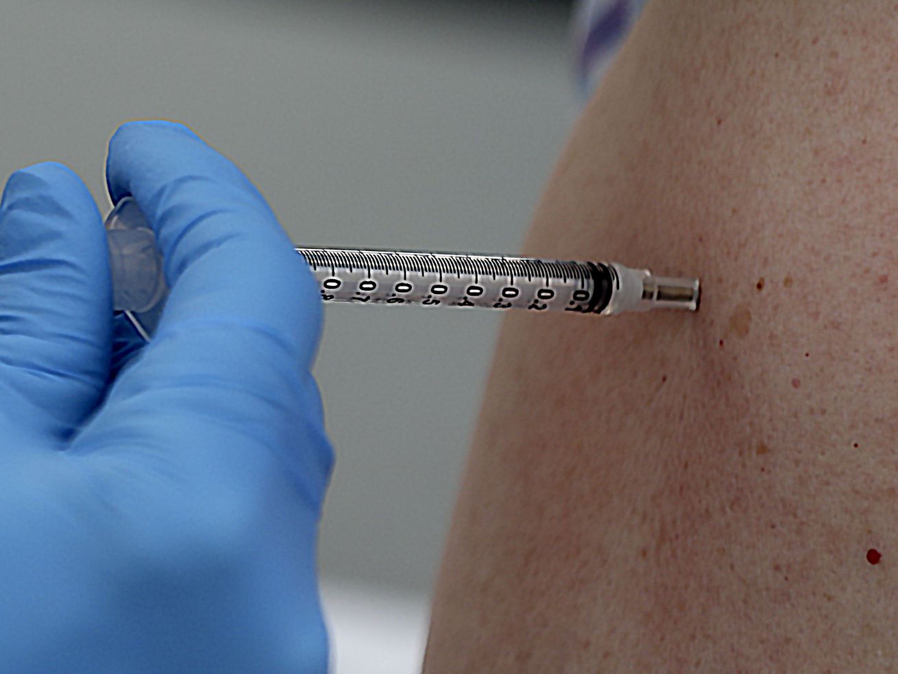 A COVID-19 vaccination is administered at a Salt Lake County Health Department at Rose Park Elementary in Salt Lake City on Sept. 22. Intermountain Healthcare announced Wednesday it will require all of its caregivers to be fully vaccinated against COVID-19.