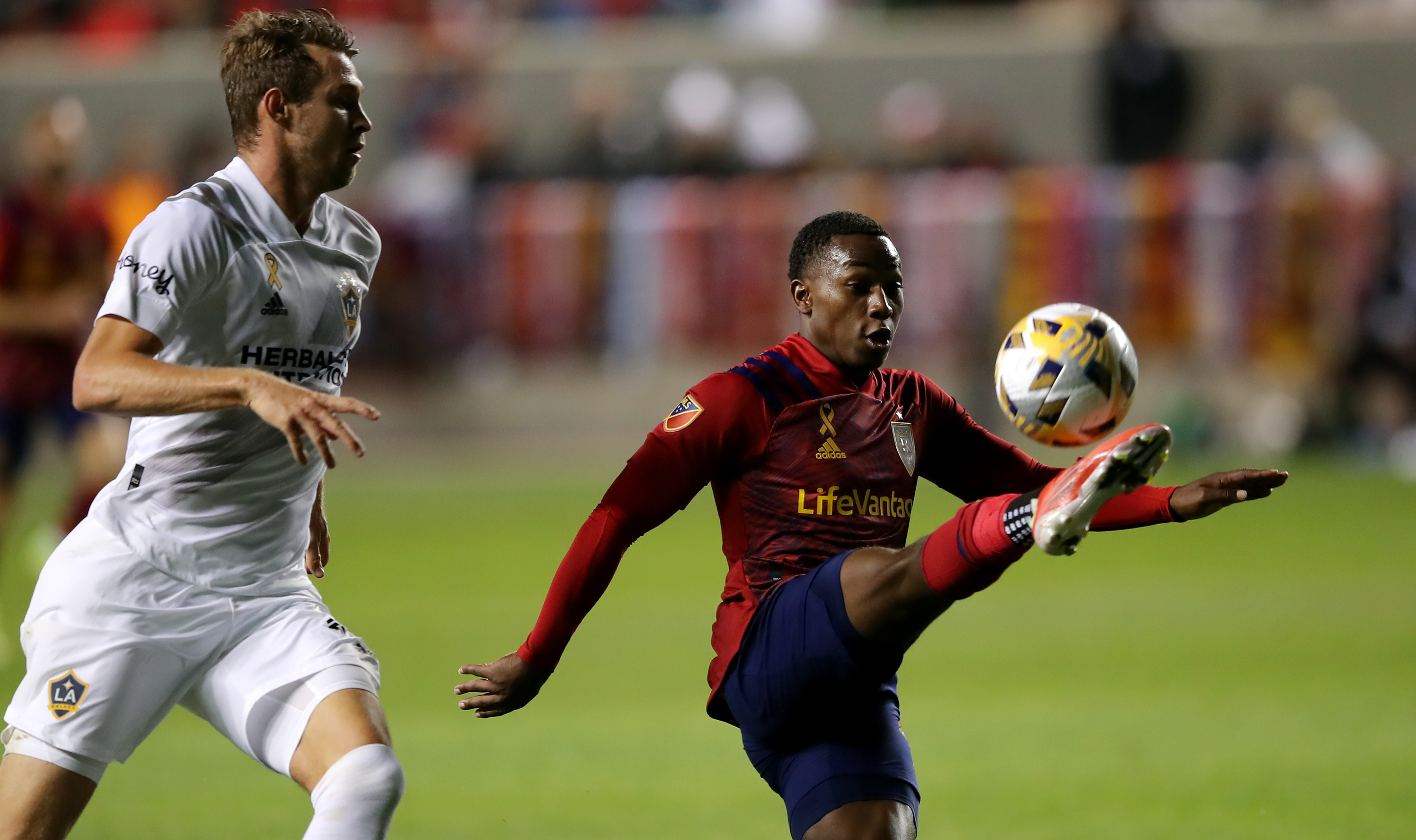 Los Angeles Galaxy defender Sega Coulibaly (4) kicks the ball away from Real Salt Lake forward Rubio Rubin (14) as Real Salt Lake and LA Galaxy play at Rio Tinto Stadium in Sandy on Wednesday, Sept. 29, 2021. RSL won 2-1.