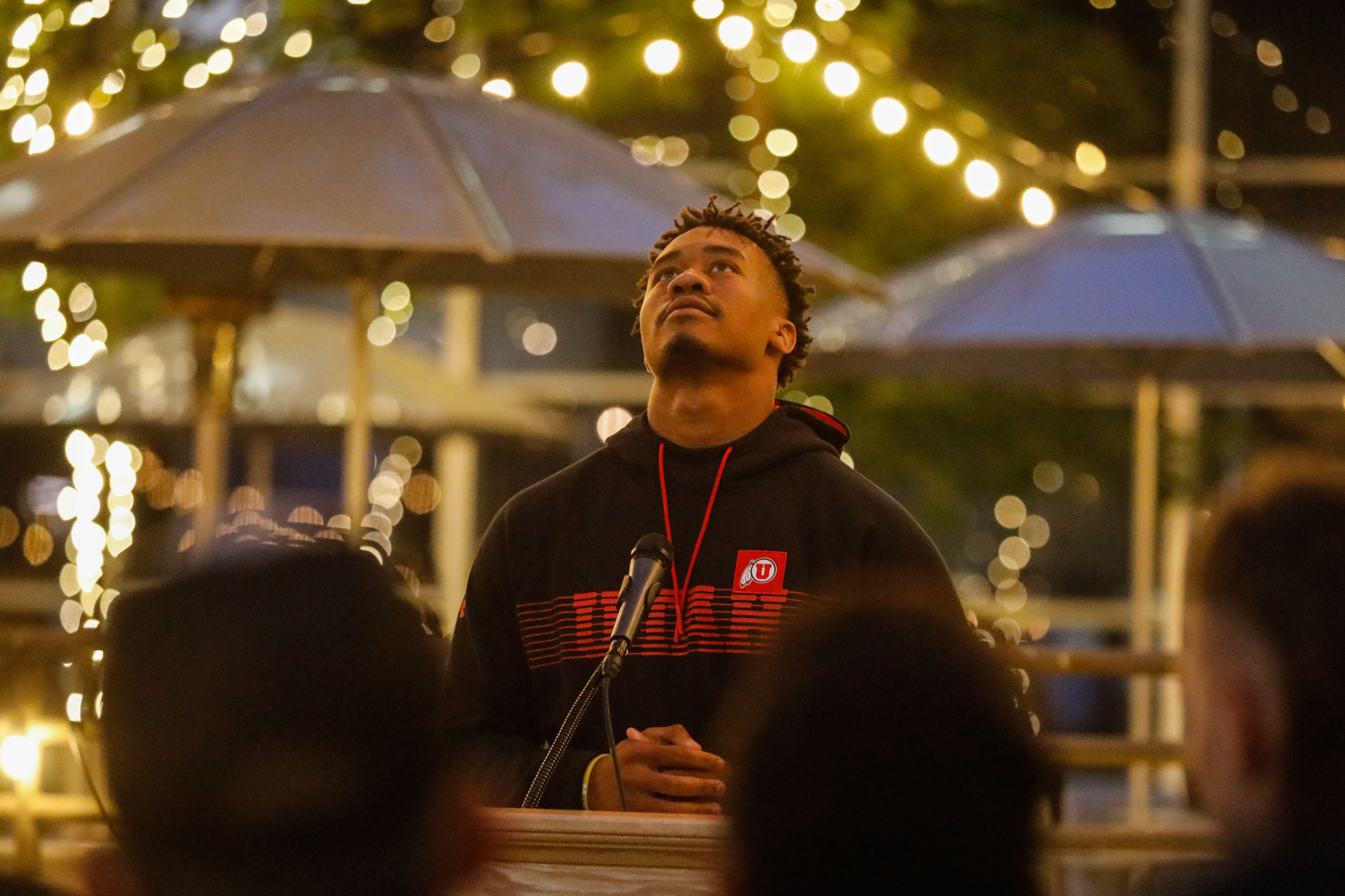 University of Utah football QB Ja'Quinden Jackson looks up as he speaks during a candlelight vigil remembering the life of slain student-athlete Aaron Lowe at the University of Utah in Salt Lake City on Wednesday.