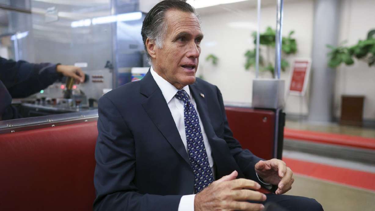 Sen. Mitt Romney, R-Utah, returns to his office after a vote at the Capitol in Washington on Wednesday. Romney wants Democrats to remove "harmful” penalties for marriage from their so-called human infrastructure bill that he says would discourage people from tying the knot.