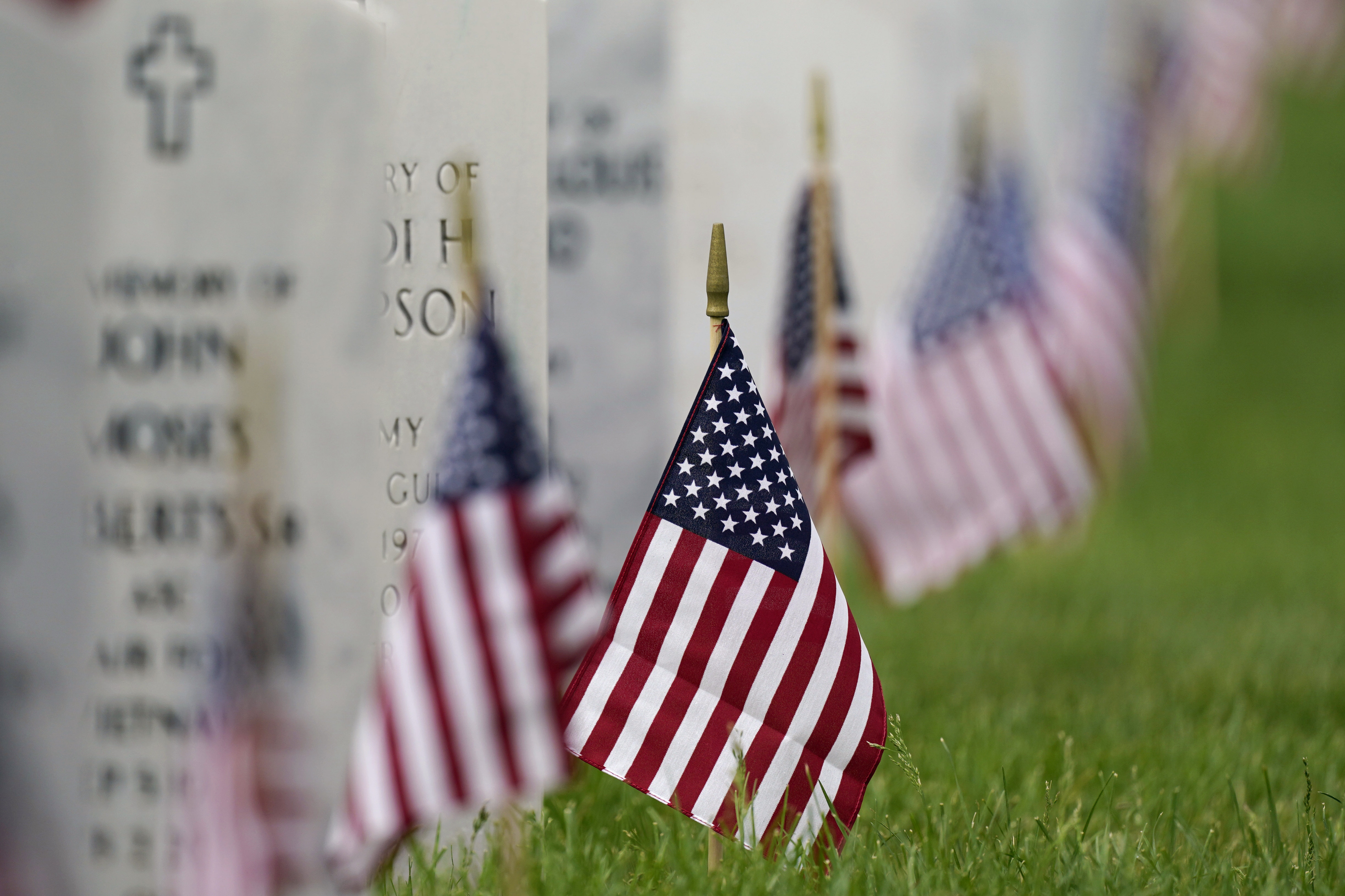 In this May 31 photo, flags and tributes mark the Memorial Day holiday at Fort Logan National Cemetery in southeast Denver. The number of U.S. military suicides jumped by 15% last year, fueled by significant increases in the Army and Marine Corps that senior leaders called troubling.