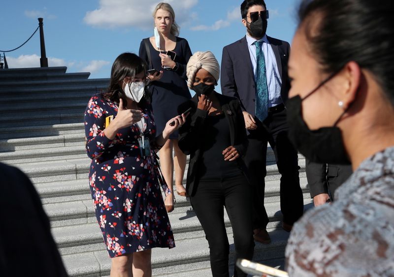 Reporters talk with U.S. Rep. Ilhan Omar, D-Minn., as she leaves the U.S. Capitol building after a vote on Capitol Hill in Washington, Thursday.